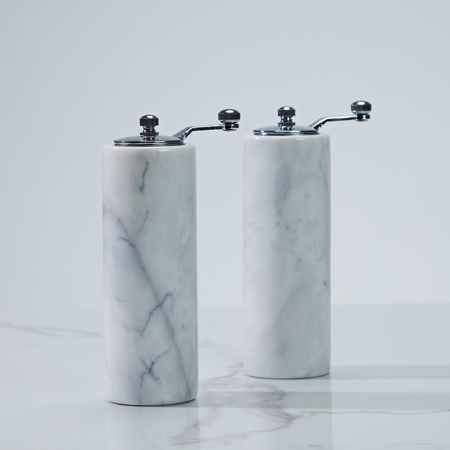 French White Marble Salt and Pepper Set with Grey Veining and Stainless Steel Shaker Plate for Stylish Kitchen and Dining Room Use