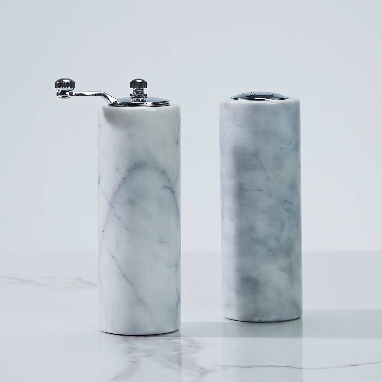 French White Marble Salt and Pepper Set with Grey Veining and Stainless Steel Shaker Plate for Stylish Kitchen and Dining Room Use