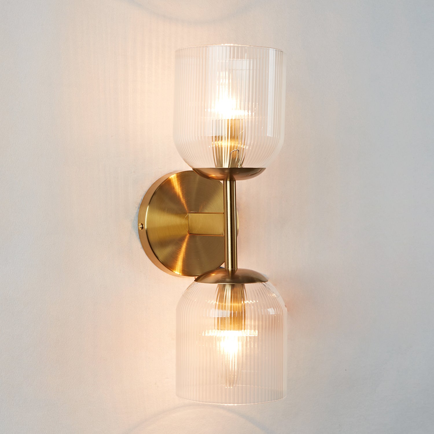 Antique Bronze Double Sconce with Ribbed Glass Shades and Bell-Shaped Design for Durable Indoor Lighting - Ideal for Bathrooms and Bedrooms