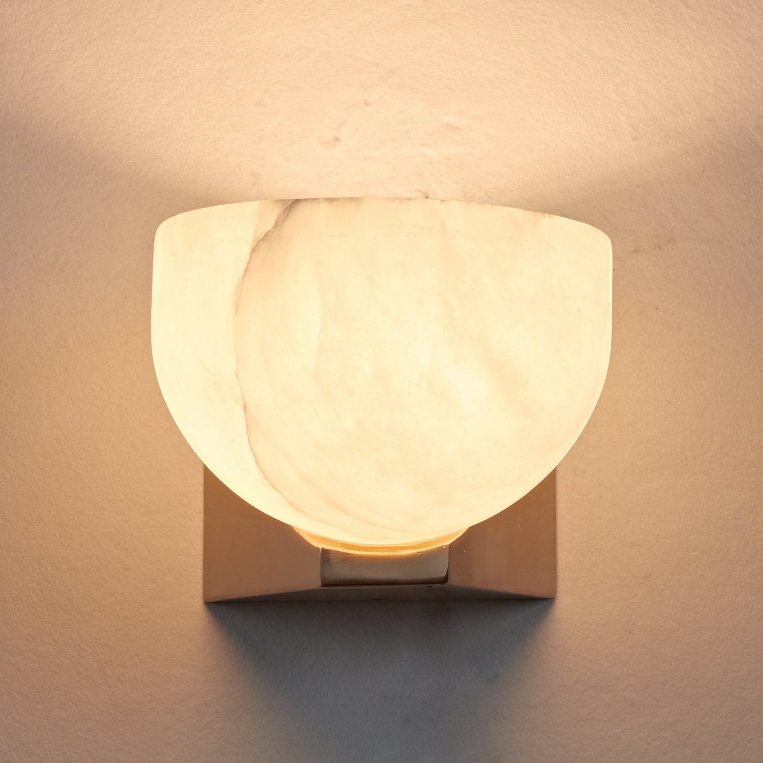 Engraved Elegance Alabaster Sconce: Handcarved Alabaster Wall Light with Globe-like Contours and Burnished Brass for Living Room, Kitchen, or Bedroom Wall Lighting