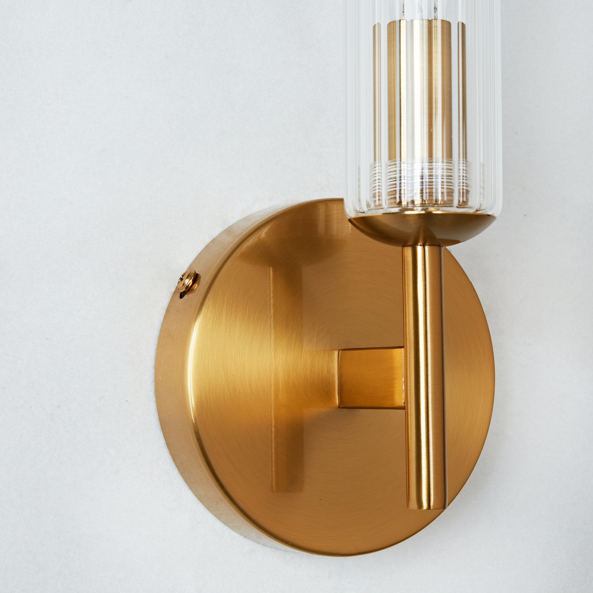 Antique Bronze Tube Sconce with Ribbed Glass Shade and Cylindrical Design for Versatile Indoor Lighting - Perfect for Bathroom and Bedroom Wall Sconces