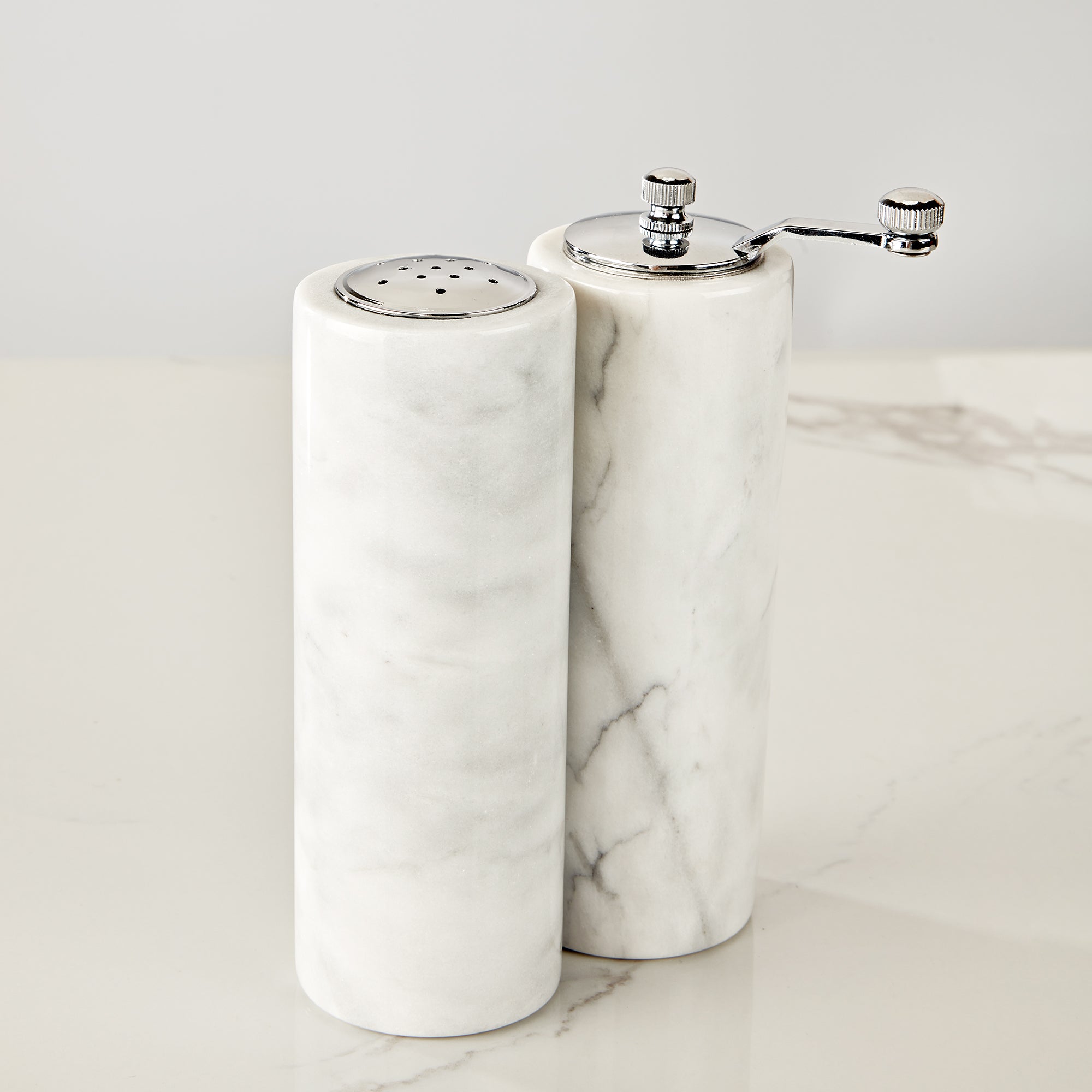 French White Marble Salt and Pepper Set with Grey Veining and Stainless Steel Shaker Plate for Stylish Kitchen and Dining Room Use